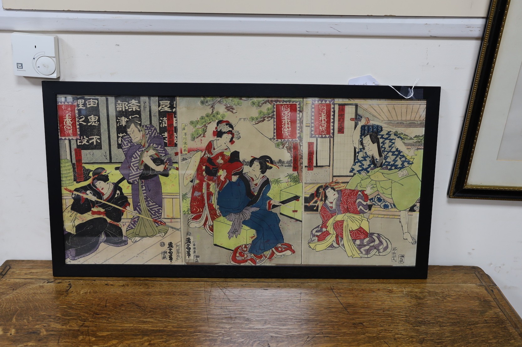 Japanese School, woodblock triptych, Actors on stage, overall 33 x 69cm